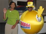 Mega Road Trip winner Tonya McDuffie (left) of Albany is pictured at airport with the Mega Ball mascot.