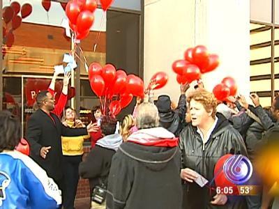 People rushed Hoosier Lottery workers during a balloon release Wednesday, in some cases trying to grab balloons before they were out of the workers' hands.