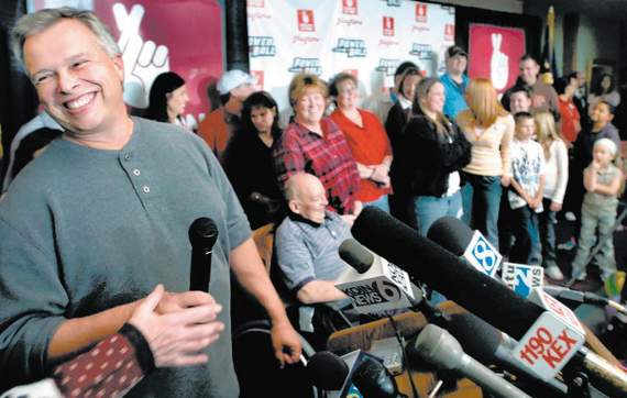 Powerball winners Steve West and Bob Chaney (in wheelchair) along with their families, celebrated their big lottery win during a press conference in Salem in November 2005. 